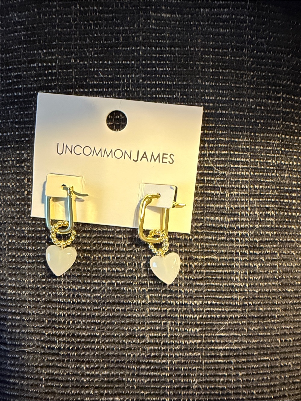 Uncommon James Gold Huggie Earrings with White Heart Charms